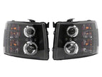 Raxiom 07-13 Chevrolet Silverado 1500 LED Halo Projector Headlights- Black Housing- Clear Lens
