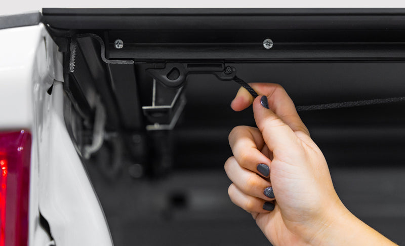 Access LOMAX 2022+ Rivian R1T 4ft 6in Bed (w/ OEM Tonneau Track) Folding Hard Cover - Black Urethane