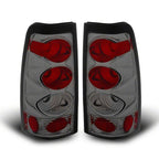 Raxiom 99-02 Chevrolet Silverado 1500 Fleetside Axial Series Tail Lights- Black- Smoked Lens