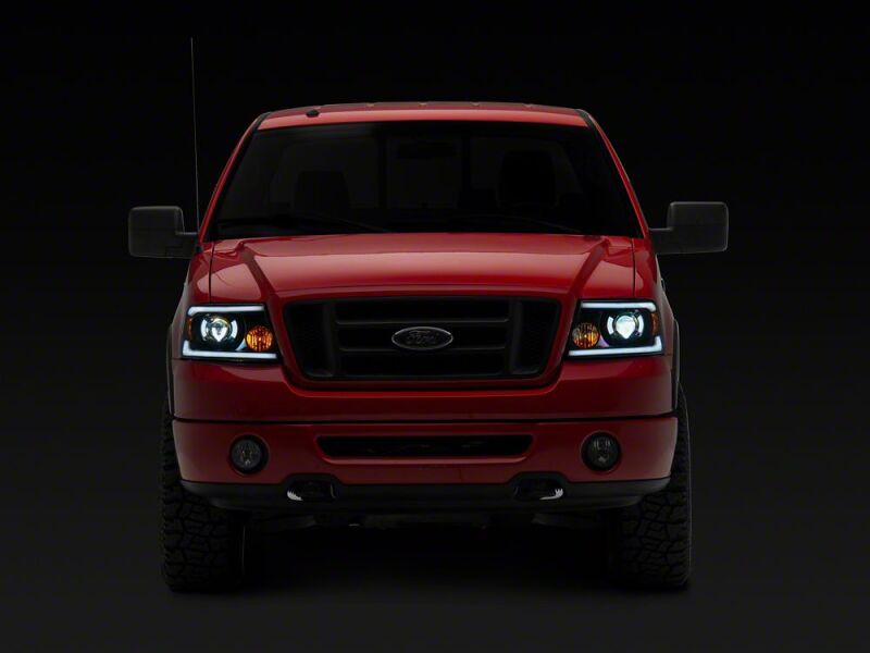 Raxiom 04-08 Ford F-150 Axial Series LED Proj Headlights/Seq LED Bar- Black- Clear Lens